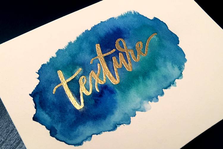 embossed lettering with watercolor texture background